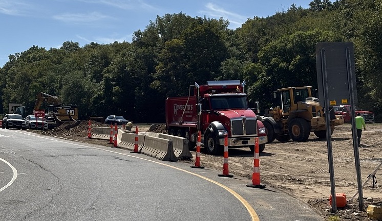 Work truck on the side of an off ramp