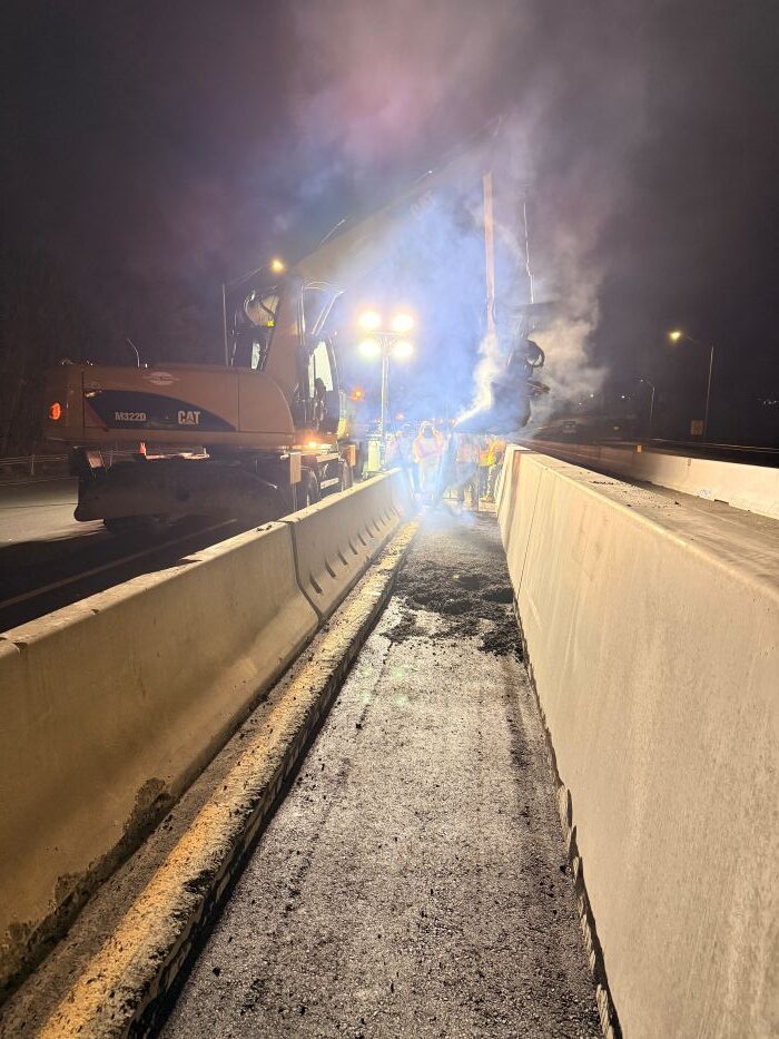 Nighttime installation of precast concrete median barrier