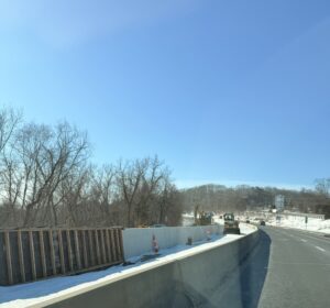 Route 8 with snow on the grass area and within the work zone