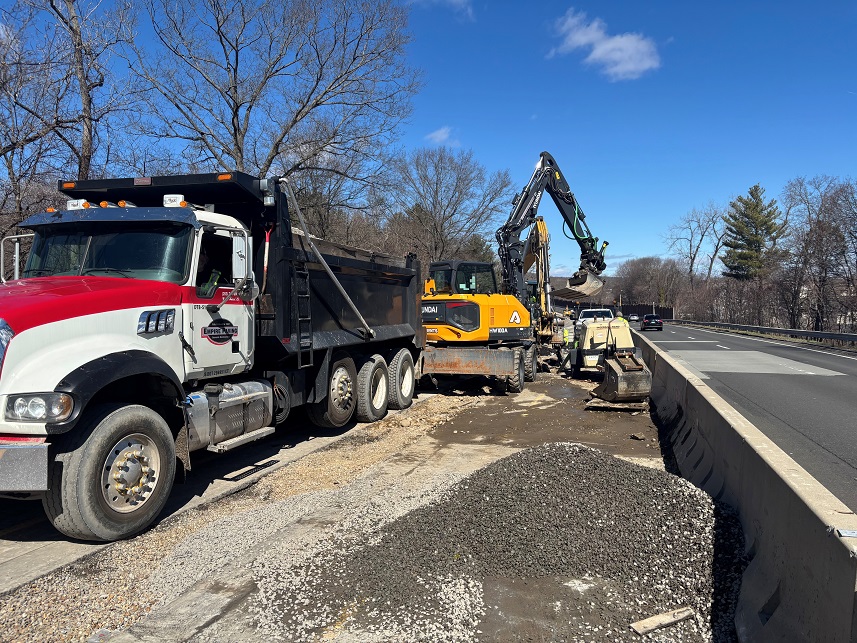 Truck and excavator in place preparing for new median construction